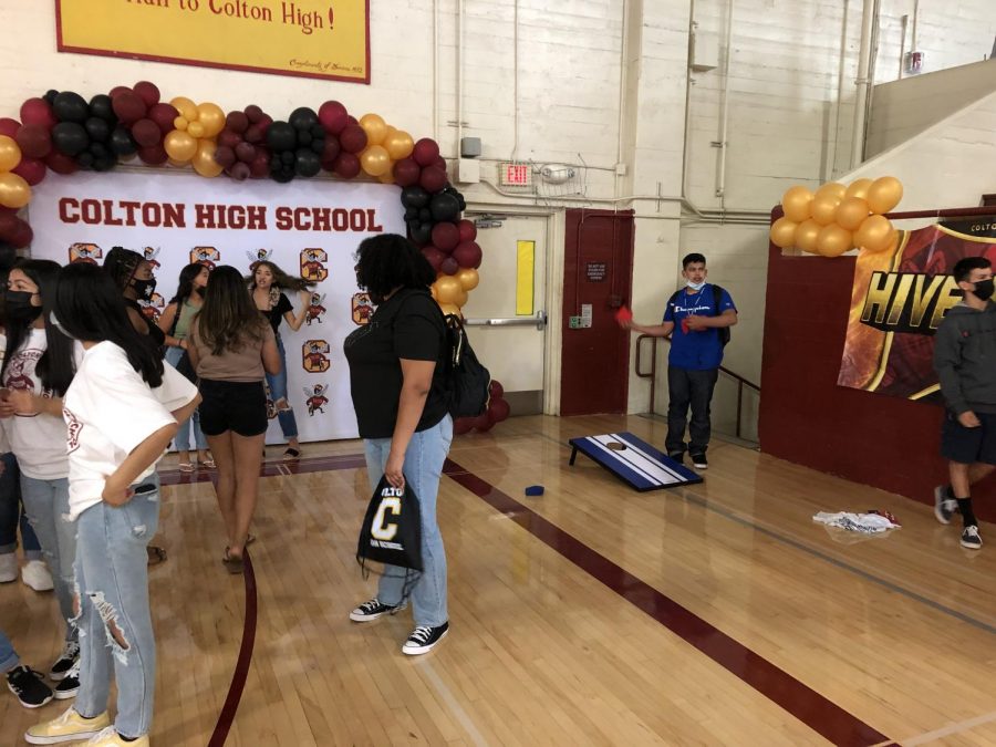 Students take photos at the photo booth and play games in the Mac Gym at lunch.