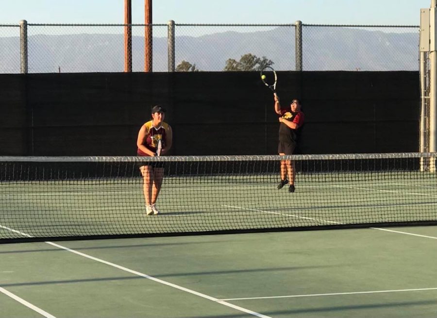 Kimberly Emilio and Sydney Castro fight back to win their set against GTs number one doubles team, 7-5.