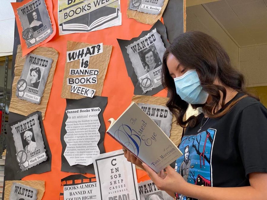 Senior Nayeli Cobarruvias-Partida checks out Toni Morrisons The Bluest Eye during the CHS Librarys celebration of Banned Book Week.