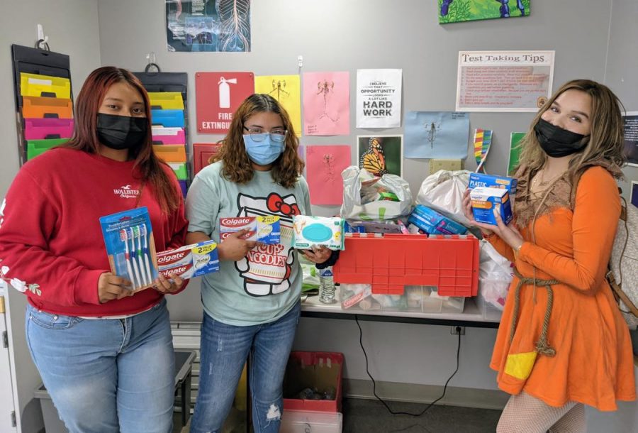 HEAL Pathway students Jasmine Almazan, Caroline Flores Castillo, and Jasmine Ray are putting together medical and hygiene packages for the communitys unhoused citizens.