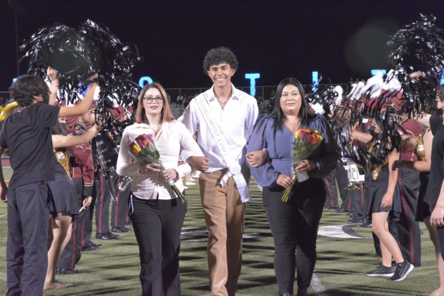 Enrique Baltazar is looking superfly as he is escorted by his mother and his biology teacher, Gloria Ramirez-Haldeman.