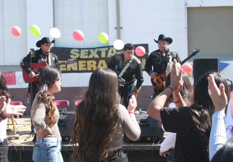 Sexta Generación (from left: Sergio Macias Duran of CHS, Ismael Martinez of GTHS, and Martin Perez Alvarez of CHS) play before the excited crowd of Colton High students during lunch on Thursday in celebration of Hispanic Heritage Month.