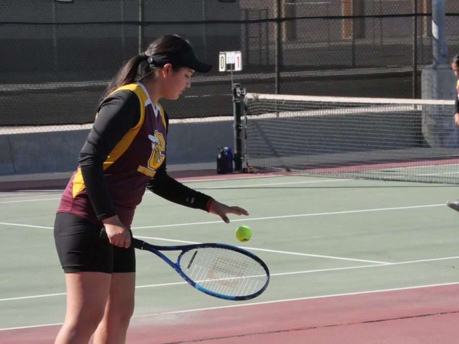 Emily Ramirez prepares for a big serve during their set against Kaisers number one team. She and her partner, Juliette Echauregui took all three of their sets against Kaiser.