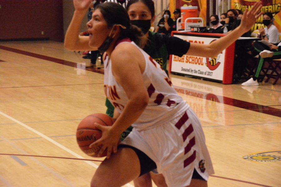 Madison Barrera pushes past the Coachella Valley defender for two of her team high 14 points. It wasnt enough, as the Yellowjackets lost 43-16.