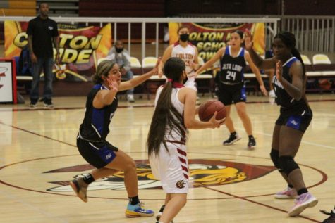 Zoey Espino drives into Alta Lomas full court press during the first half of the Yellowjackets 56-18 loss.