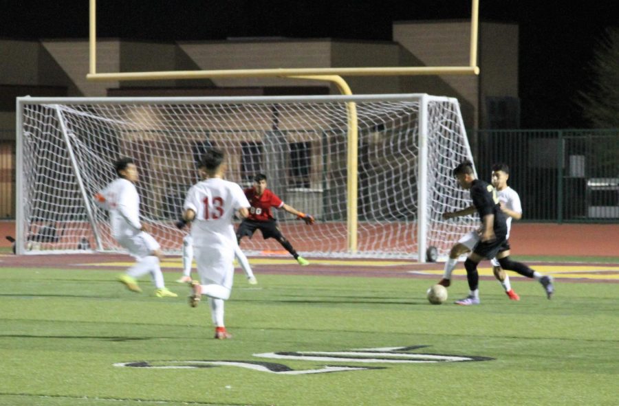 Ghael Razo attacks the Desert Mirage defense during the 1st half of the Yellowjackets 3-1 victory over the Rams.