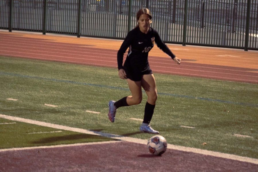 Anna Bailey dribbles her way to one of her three goals in the match against Jurupa Hills.