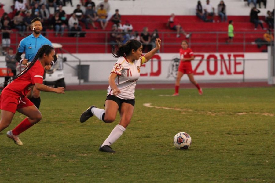 Senior Emma Arroyo races to the ball against Palm Springs in their first round CIF playoff matchup.