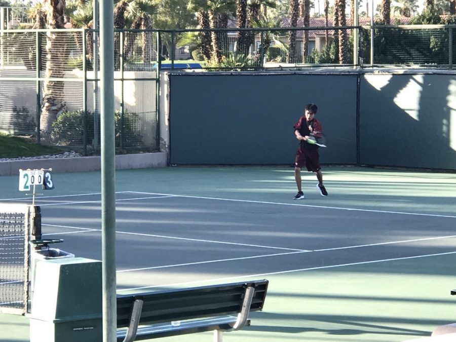 Andrew Diaz going for a strong two-handed backhand against Coachella Valley.