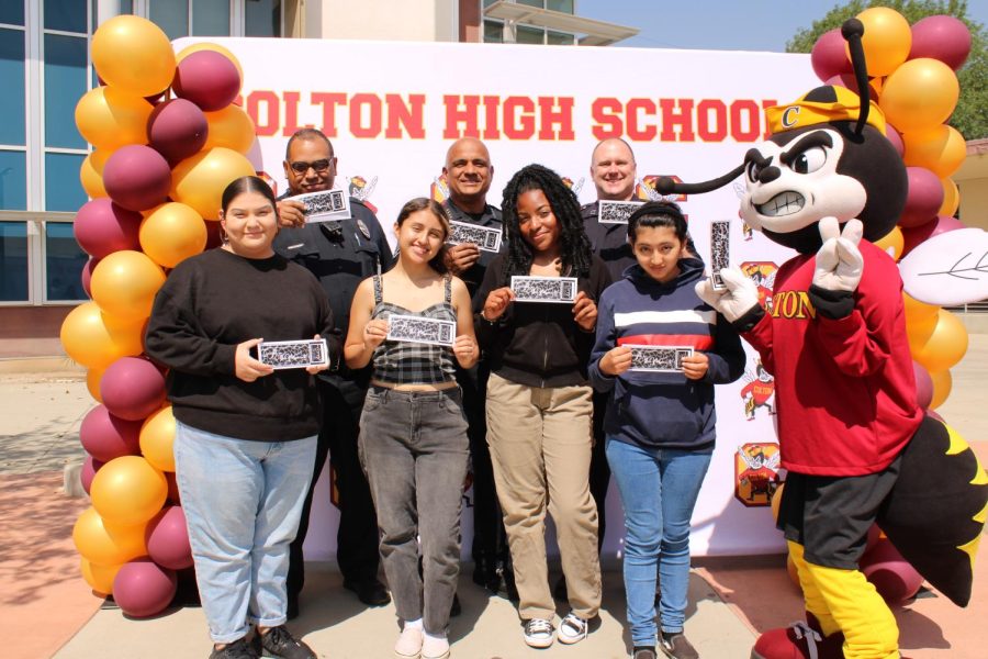 Colton PD presents CHS standout with free prom tickets. Back row: Officer Rich Randolph, Police Chief Henry Dominguez, Captain Tim Heuesterburg; Front row: Lucy Lopez, Yvette Gonzalez, Mercy Mgbemere, Kimberly Ramirez Ramirez