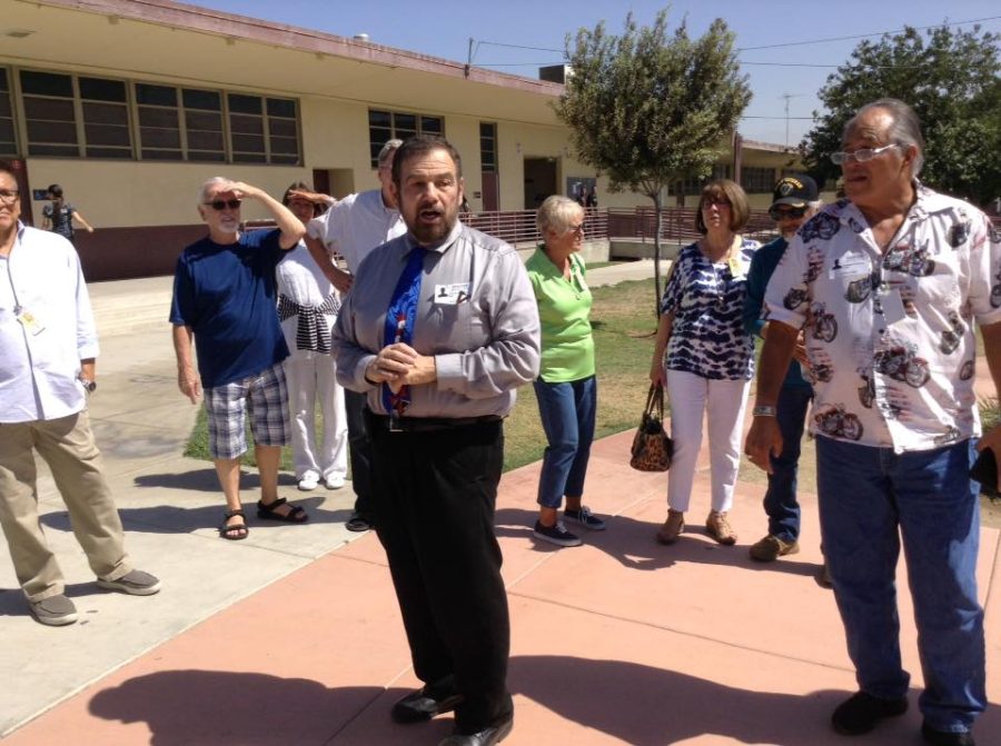Victor Schiro takes a group of Colton community members on a tour of the high school in Sept. 2018.