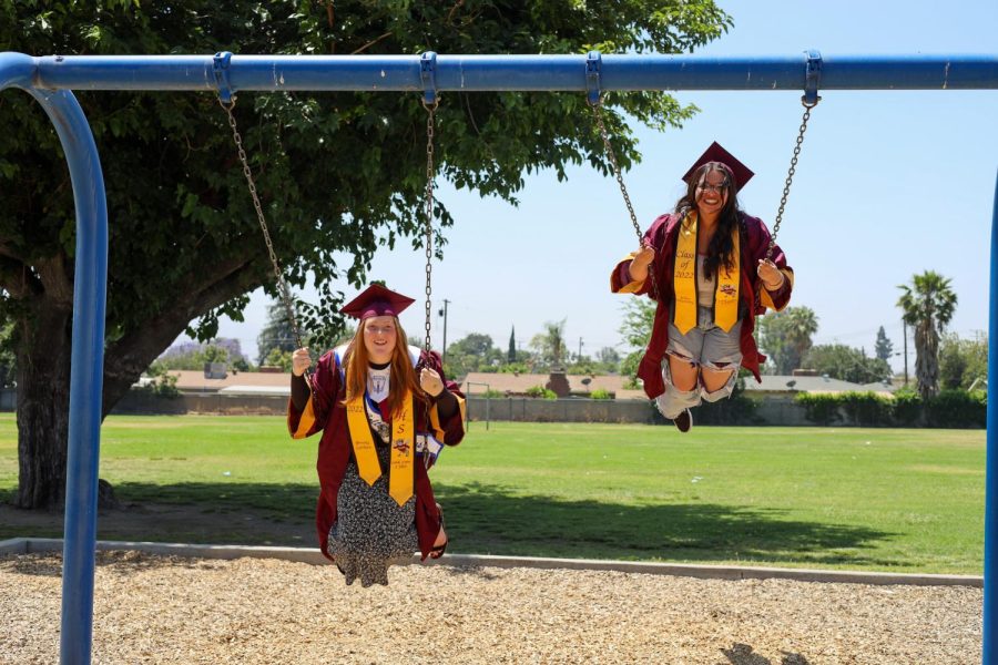 Brooke Carlson and Elisa Murrieta flashback to simpler times on the swingset at Grant.