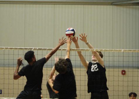 Calvin Walewangko and Andres Fregoso rise to block Beaumonts attack.