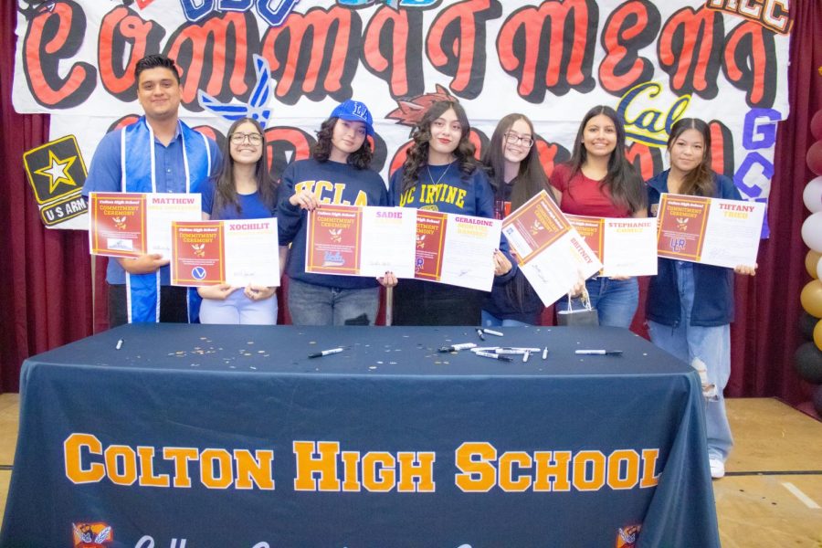 Colton Highs seniors sign their commitments to post-secondary institutions. Featured are (from left): Matthew Sosa, Xochilit Jimenez Muniz, Sadie Larios, Geraldine Montiel Ramirez, Britney Daigle, Stephanie Gomez, and Tiffany Trieu.