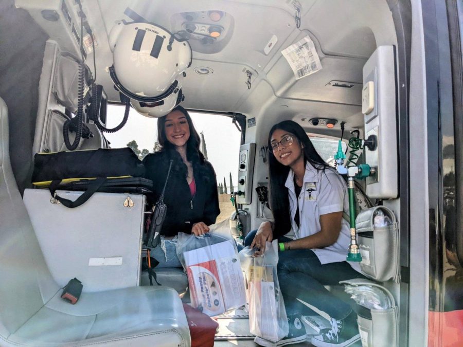 Natalie Lopez and Irma Romero Hernandez enjoy time in the medical chopper during the Emergency Medical Expo.