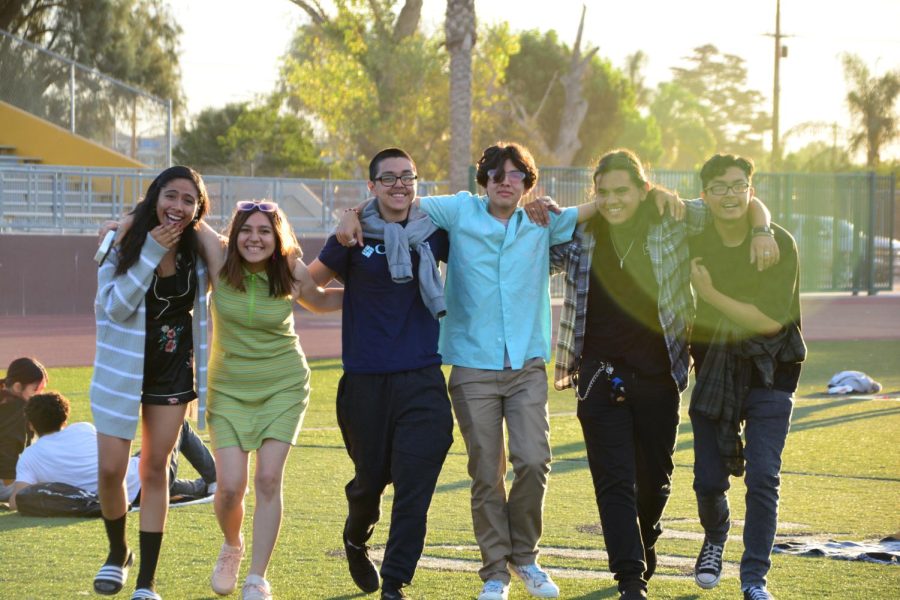These friends (from left: Emily Ramirez, Vivian Guevara, Benjamin Velarde, Noah Limon, Matthew  Cortes, and Luis Garay) wrapped their arms around each and celebrated the sunrise by skipping around the football field.