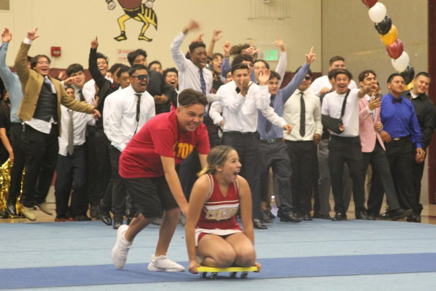 Leila Navarro and Christian Jason make for the finish line in the athletic team relay competition.