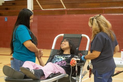HEAL Student Diane Orozco supports a blood donor at the first LifeStream Blood Drive of 2022-23.