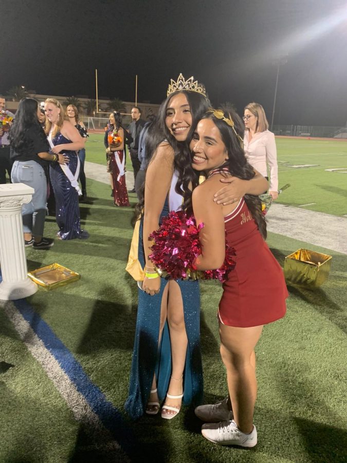 At the 2021 Homecoming, Denise hugs her sister, Dannya, after she won the Homecoming crown.