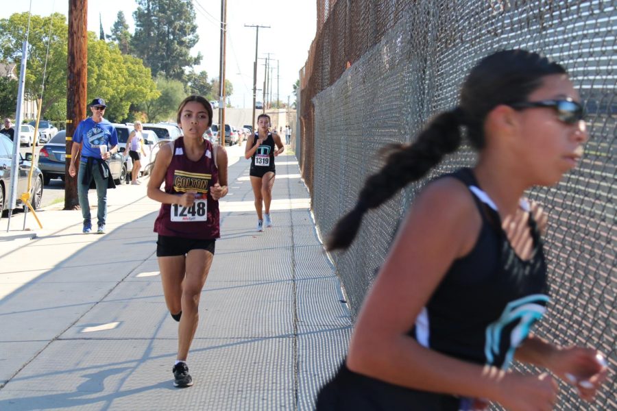 Briana+Jimenez+is+the+only+Colton+runner+this+Cross-Country+season+to+qualify+for+CIF.+Here+she+is%2C+turning+the+corner+onto+Rancho+Avenue+during+Saturdays+San+Andreas+League+Finals+at+CHS.