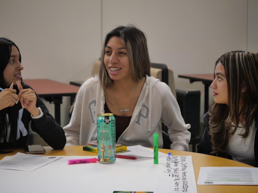 Natalie Lopez (left) and Destiny Verduzco (center) discuss dress code concerns at the monthly Student Forum.