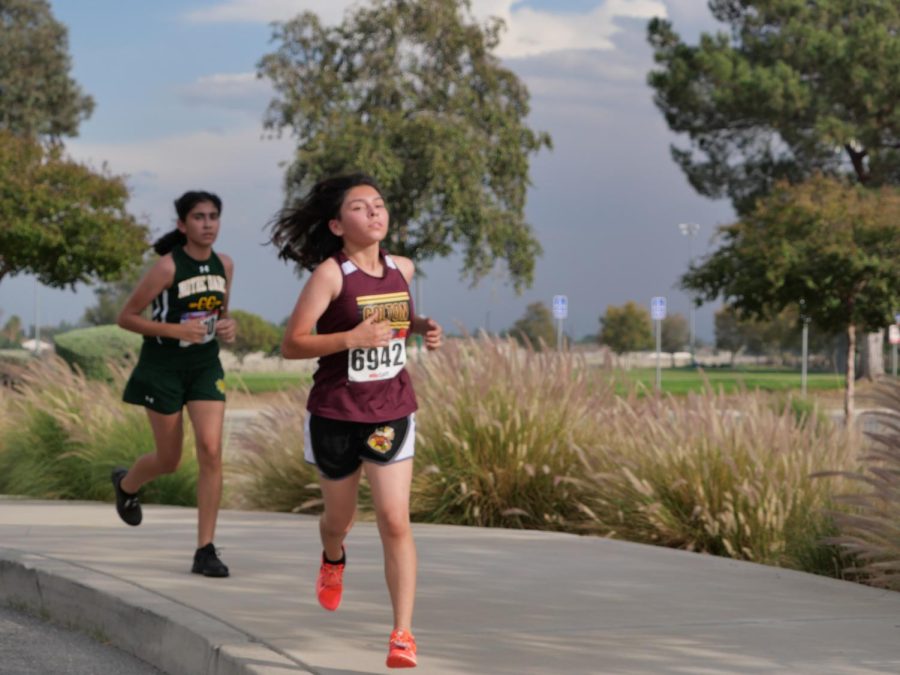 Diana Ruvalcaba enjoys the run at Jerry Eaves Park in Rialto for the third San Andreas League Meet of the season. She finished in 11th place with a time of 23:58.7.