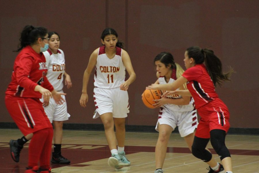 Naomi Ontiveros fights for the loose ball against AB Miller.