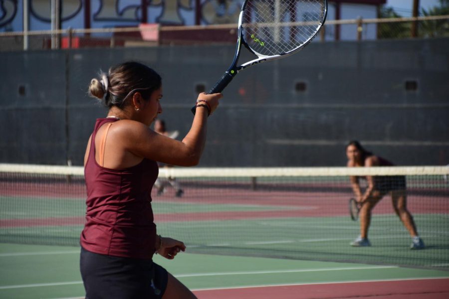 Shantel Marentes leads her teammates on the Yellowjacket ladies tennis team into battle against the San Jacinto Tigers in round one of the 2022 CIF Ladies Tennis Playoffs.