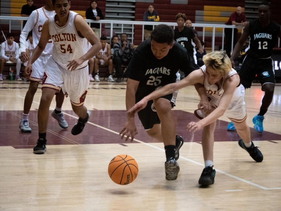 Patrick Angulo shows he is more than a sharpshooter, hustling to get after the loose ball.