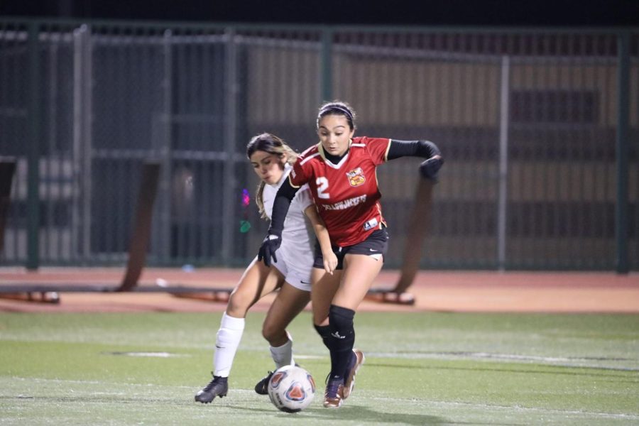 Laura Yanez fights for the ball against the Kaiser Cats. The match ended in a 2-2 tie.