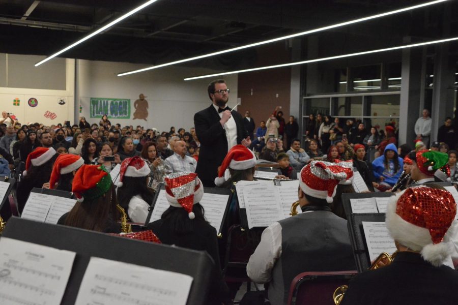 Band Director Kenneth Taber leads the wind ensemble in their performance of A Cartoon Christmas at the annual Winter Concert.