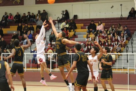 Devin Torrez scores 3 of his 15 points during the 4th quarter of the Yellowjackets loss to Rubidoux, 66-48.