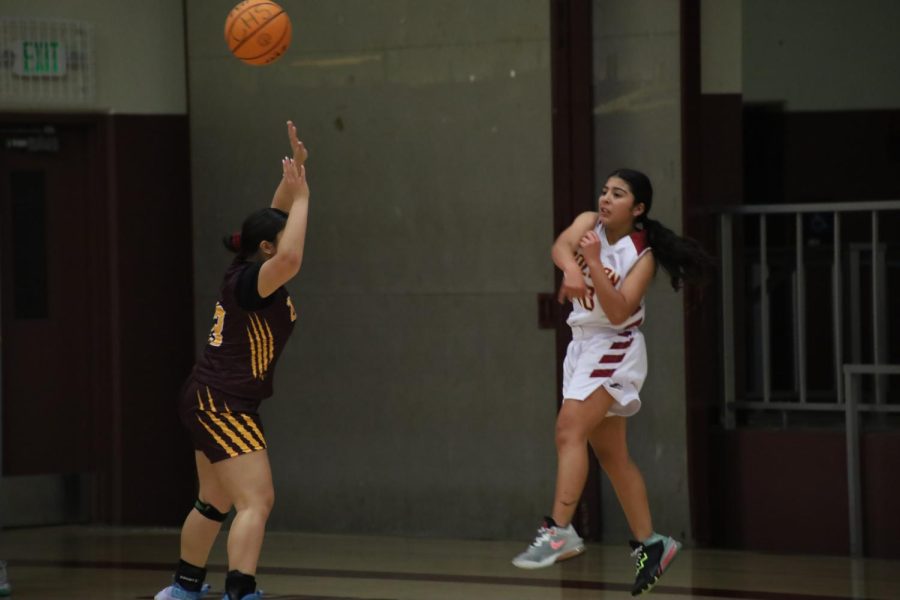 Savannah Govea saves a ball from going out of bounds and flings it to a teammate.