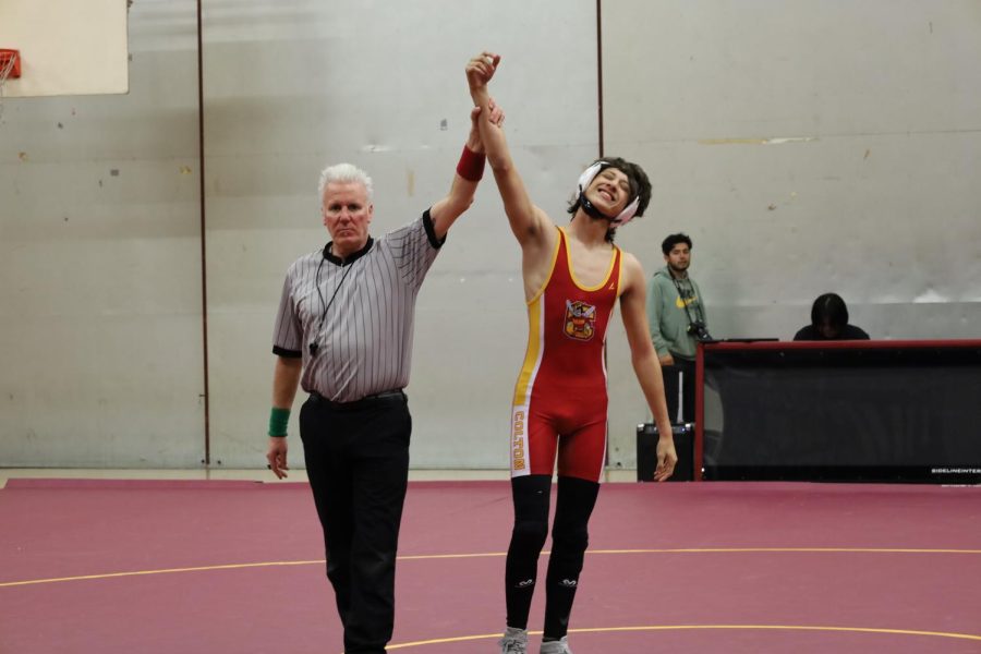 Cesar Loera shows off his confident grin after defeating San Gs Angel Nieblas by pin in the first round.