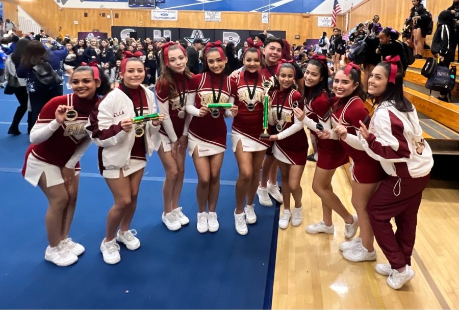 The Colton Cheer squad shows off its first place hardware after winning the varsity cheer division at the annual SHARP Cheerleading Competition in El Monte on Dec. 10.