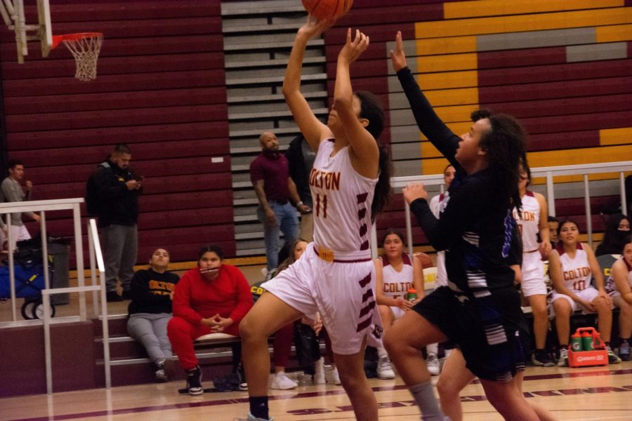 Zoe Nunez uses her length on this drive to the hoop during the second half to score 2 of her 3 points. 