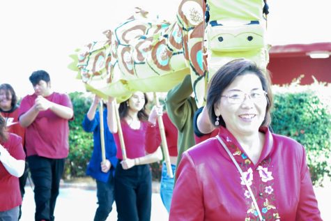 Ms. Yuh-Jin Lin leads a group of students in her Mandarin I class in their ceremonial Dragon Dance to honor the Lunar New Year.