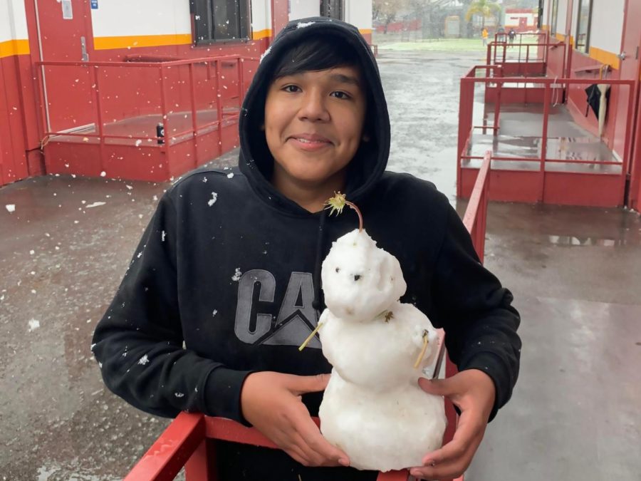 Gustavo Arellano holds George the Snowman, built by students in Mr. Levines AP World History class during their Saturday School test prep session on Feb. 25.