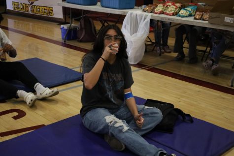 Junior Jasmine Jimenez gives the thumbs up after giving blood on Mar. 9 at the HEAL Pathway Blood Drive.