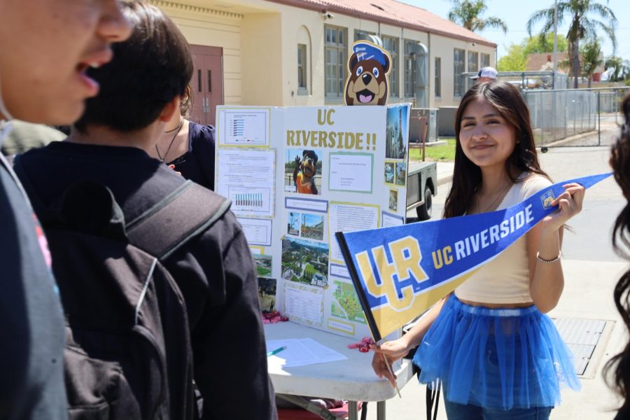 Ashley Galvan teaches Colton students about UC Riverside at the annual AVID College Fair.