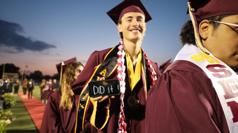 Angel Losoya celebrates his graduation as the seniors line up to cross the stage.