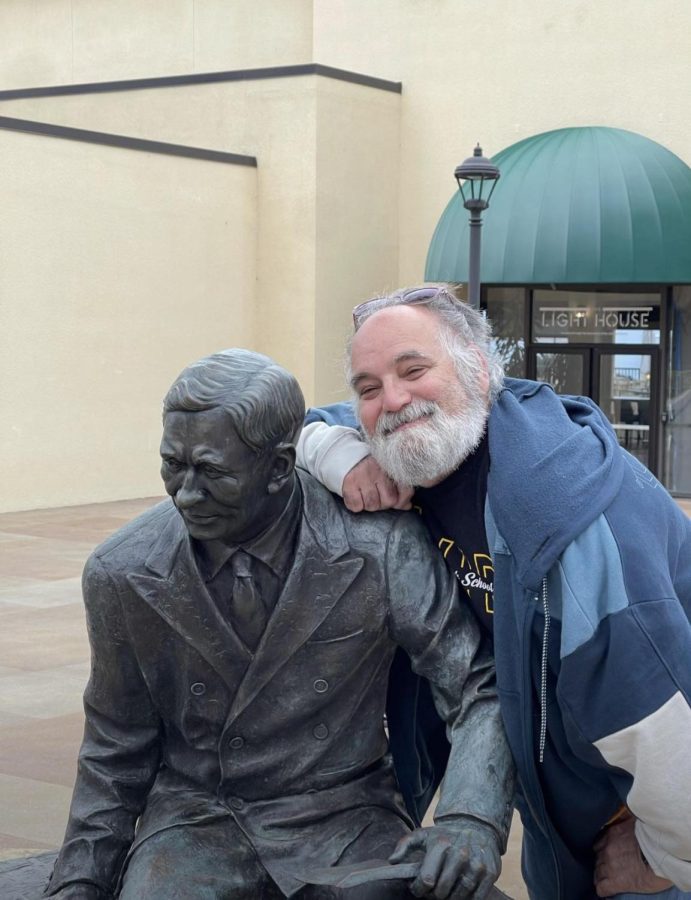 Mr. Levine makes a new friend: Mr. George Pepperdine, whose statue sits atop Barneys Bench overlooking Mullin Square on the universitys campus.