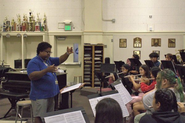 Band Director Aron Campbell works with students in his 6th period wind ensemble class.