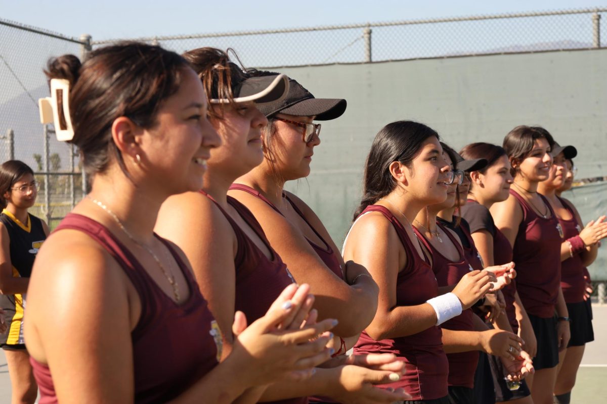 The ladies tennis team gets excited about the possibility of a championship before their match against San Gorgonio.