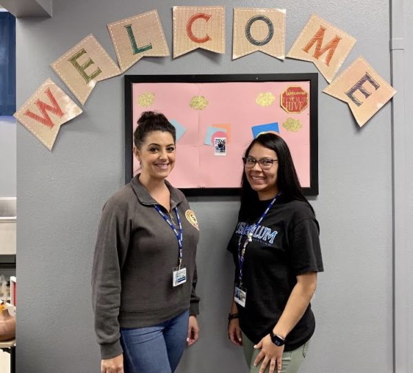 Brand new Wellness Coordinators Theresa Rago (left) and Myriam Whall (right) welcome in new students into the Wellness Center. 