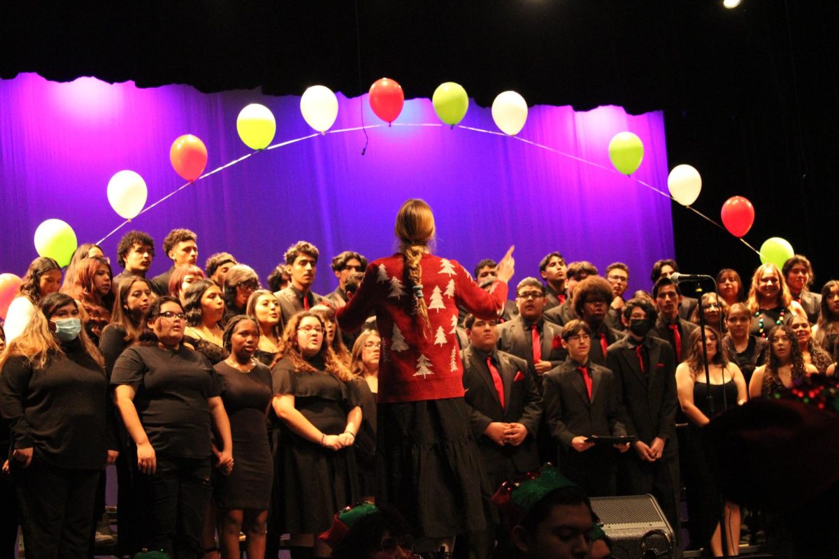 Dr. Jessica Cannaday leads the choir in their performance of holiday classics.