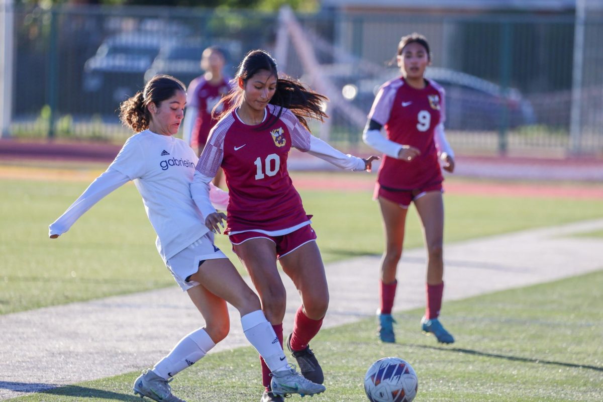 Asolesi Rizo fights to keep the ball away from the Gabrielino defense.