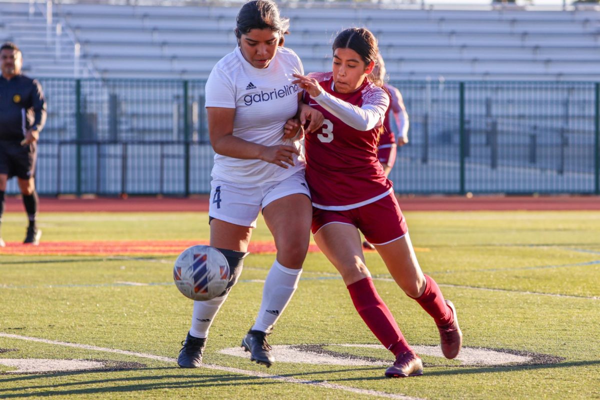 Elena Vargas fights for control of the ball.