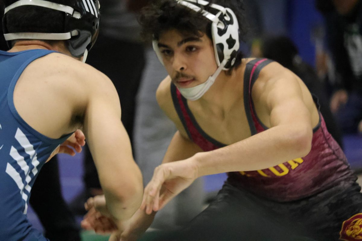 Aiden Arroyo looks for the right opening to attack his opponent from Aquinas. 