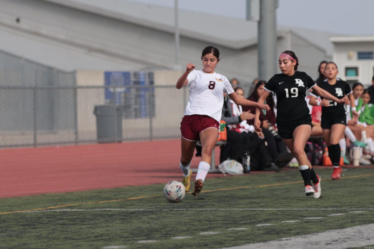 Tiffany Abril races down the wing to get the ball back into Panther territory.